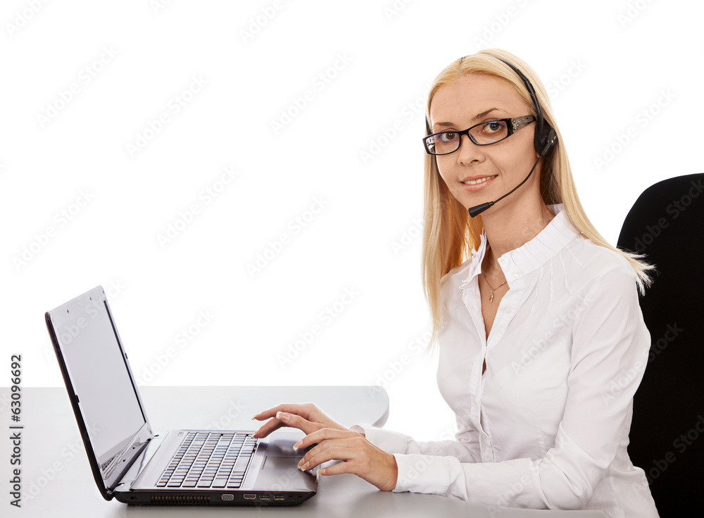 Secretary beautiful girl in headphones for a laptop, smiling. Secretary beautiful girl in headphones for a laptop, smiling.