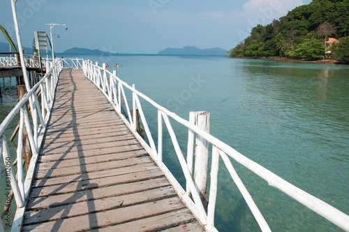 White wooden bridge at the sea