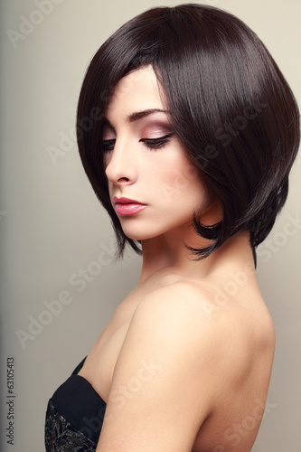 Beautiful elegant female model with black short hair