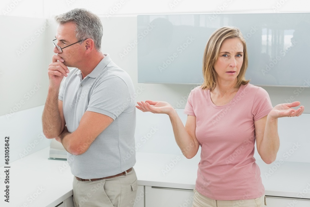 Fototapeta premium Unhappy couple having an argument in kitchen