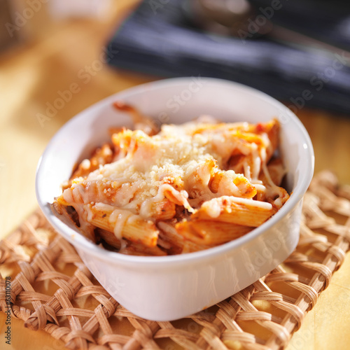 baked penne and mozzarella cheese photo