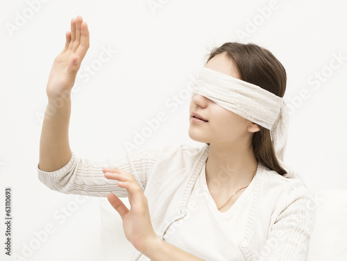 young girl with a blindfold