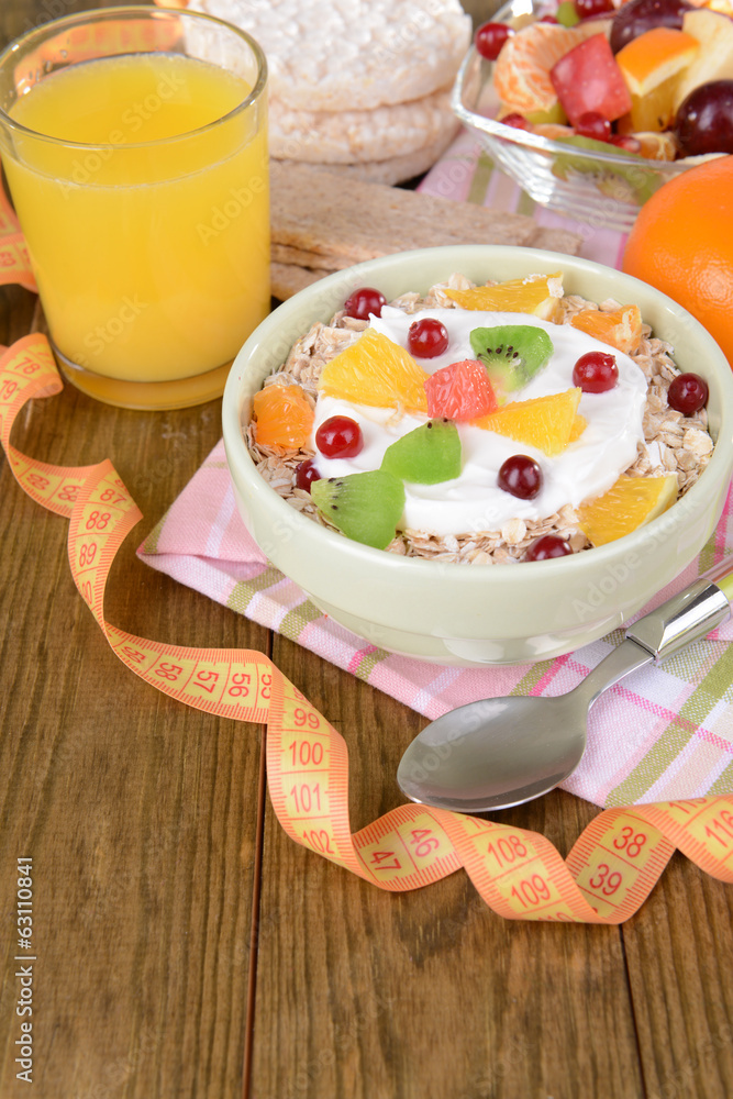 Delicious oatmeal with fruit in bowl on table close-up Delicious oatmeal with fruit in bowl on table close-up