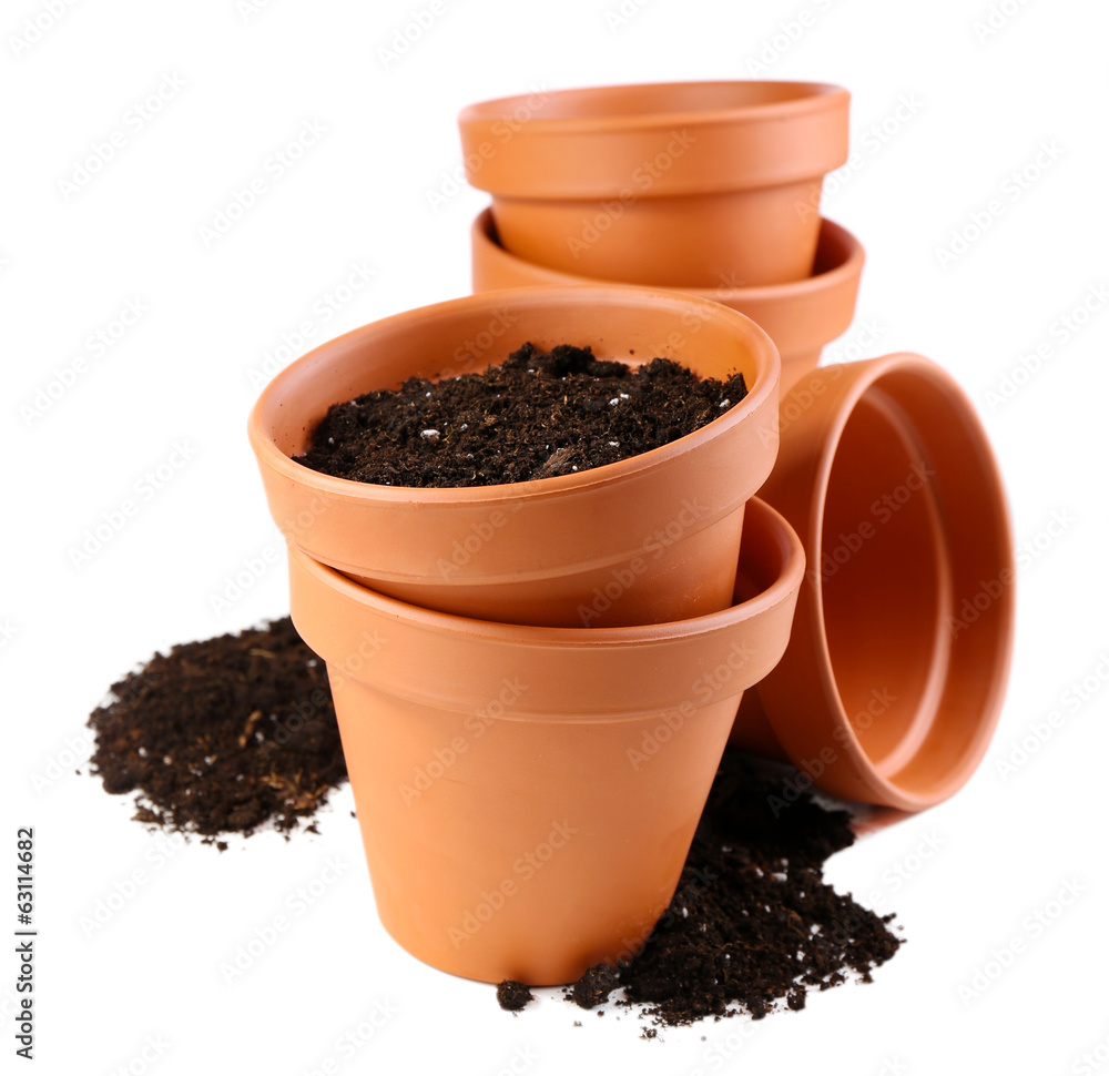 Clay flower pots and soil, isolated on white Clay flower pots and soil, isolated on white