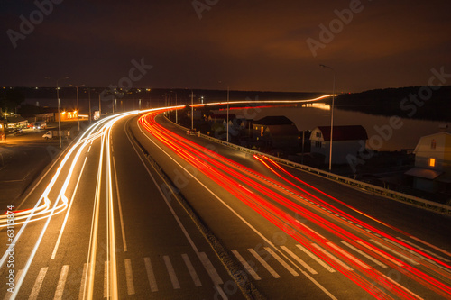 Crosswalk in lights on the night highway traffic