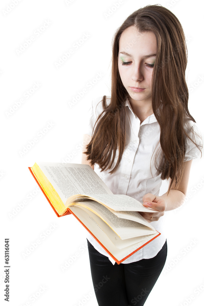 young girl is reading a book while standing young girl is reading a book while standing