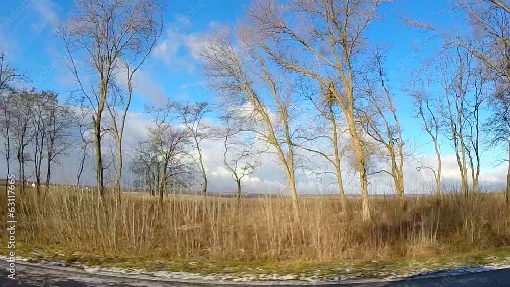 Spring Driving View with Last Snow, Dramatic Blue Skies and Clou Spring Driving View with Last Snow, Dramatic Blue Skies and Clou