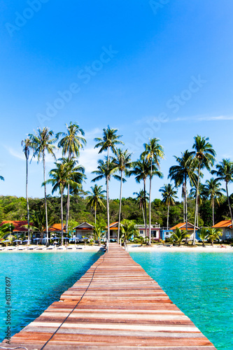 jetty that leads to an tropical island