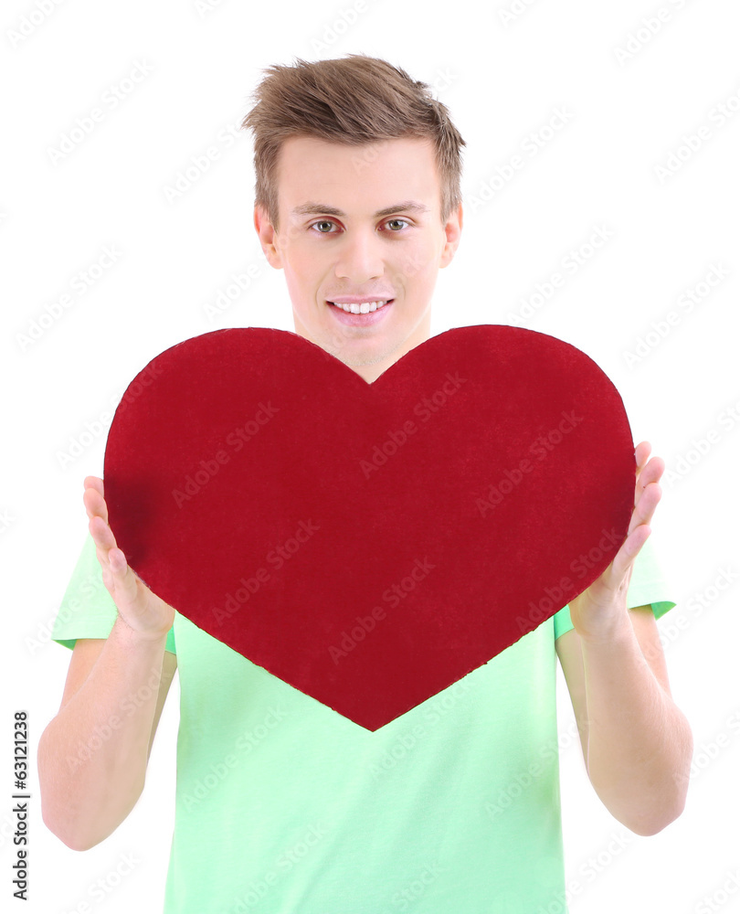 Handsome young man with big red heart, isolated on white Handsome young man with big red heart, isolated on white