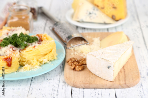 Composition with tasty spaghetti, grater, cheese,