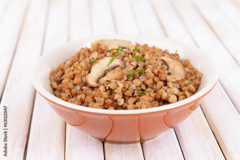 Boiled buckwheat in bowl on table close-up Boiled buckwheat in bowl on table close-up