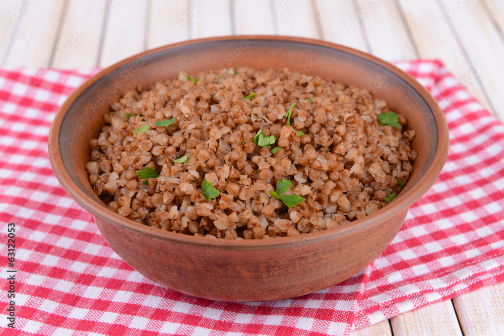 Boiled buckwheat in bowl on table close-up Boiled buckwheat in bowl on table close-up