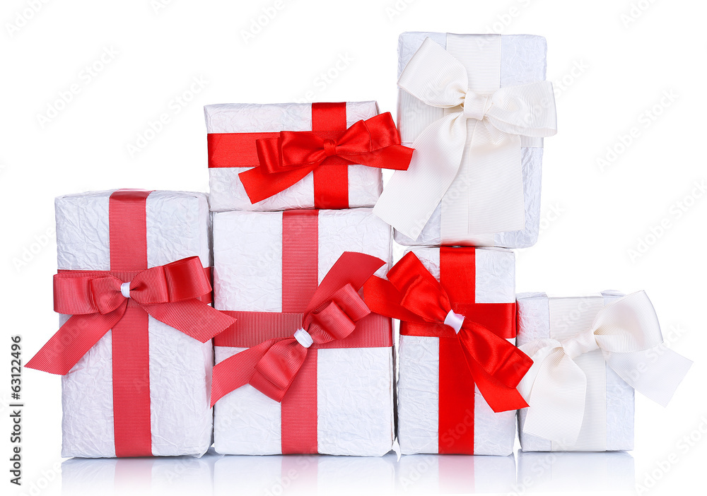 Beautiful gifts with red ribbons, isolated on white Beautiful gifts with red ribbons, isolated on white