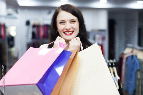 woman with bags at fashion boutique