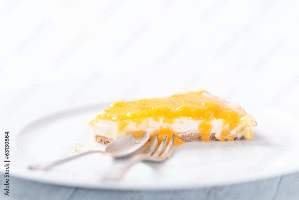 Piece of a delicious homemade cheese cake with passion fruit top Piece of a delicious homemade cheese cake with passion fruit top