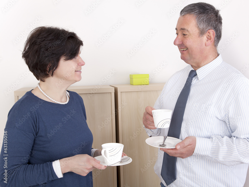 Man and woman chat over a cup of coffee Man and woman chat over a cup of coffee