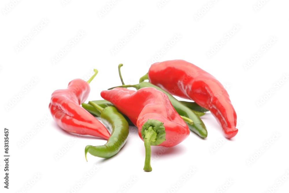 Red and green chili peppers isolated on the white Red and green chili peppers isolated on the white
