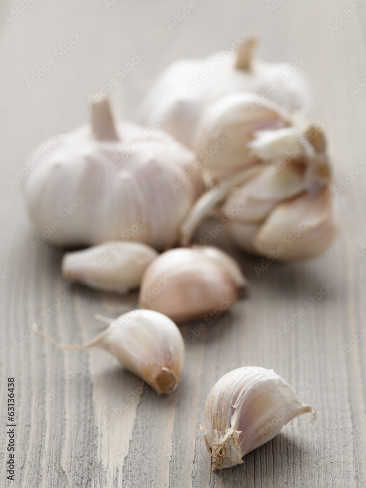 garlic on wood table garlic on wood table