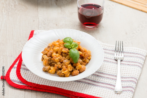 Pisarei o gnocchetti con sugo di fagioli photo