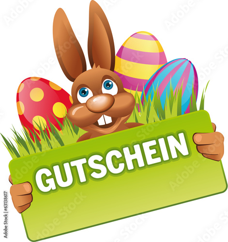 Osterhase hält grünes Schild Gutschein
