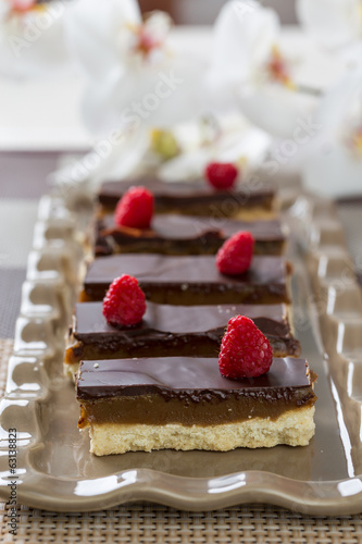 baked dessert with raspberries