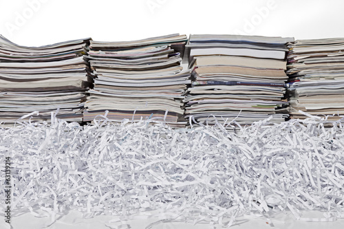Stacked Magazines and Shredded Paper