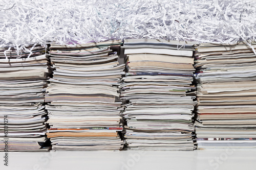 Stacked Magazines and Shredded Paper