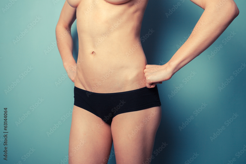 Slender young woman in black underwear Slender young woman in black underwear