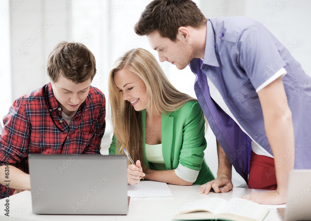students writing test or exam in lecture at school students writing test or exam in lecture at school