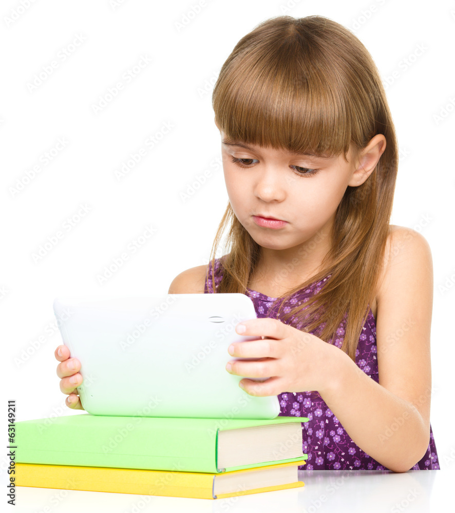 Young girl is using tablet Young girl is using tablet