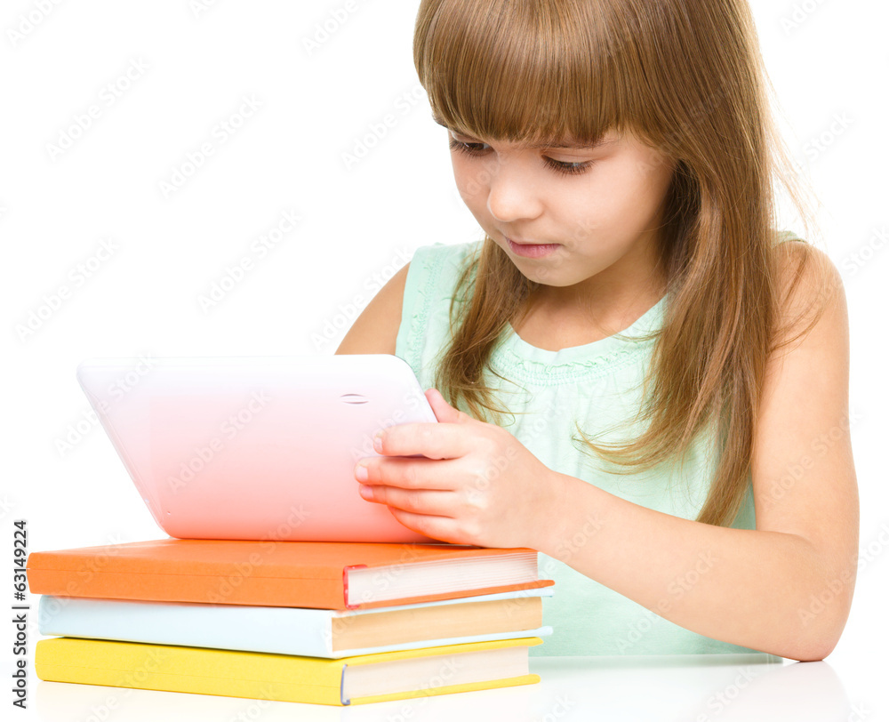 Young girl is using tablet Young girl is using tablet