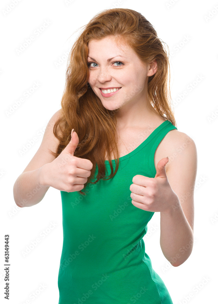 Woman is showing thumb up gesture Woman is showing thumb up gesture