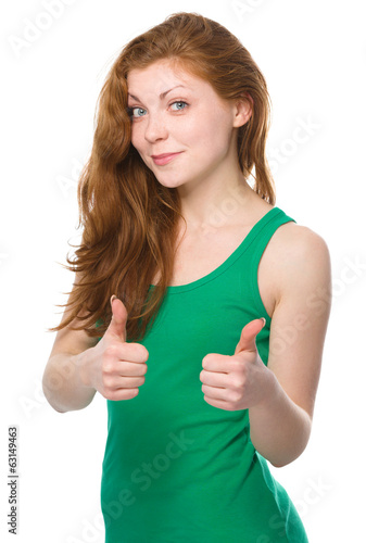 Woman is showing thumb up gesture