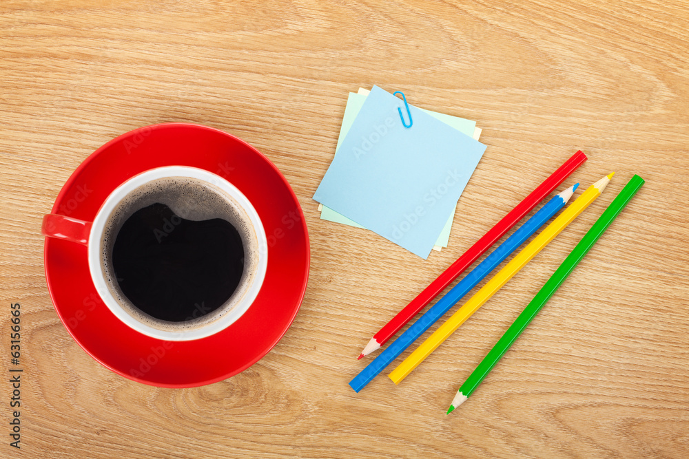 Blank post-it with office supplies and coffee cup Blank post-it with office supplies and coffee cup