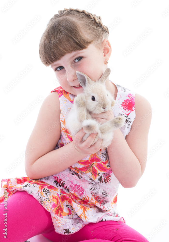 Cute little girl with her pet rabbit Cute little girl with her pet rabbit