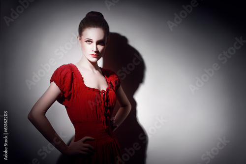 Young woman in red poirtrait photo