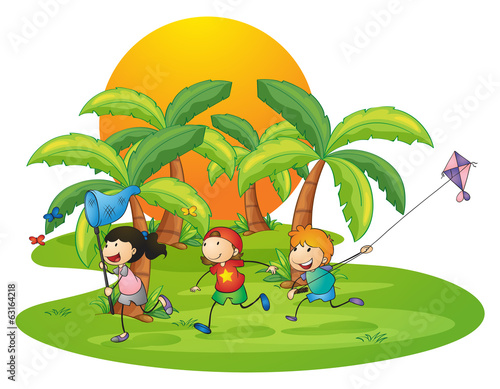 Kids playing in the island near the palm trees