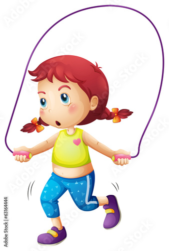 A cute little girl playing skipping rope