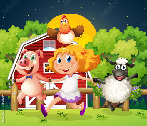 A girl playing with the farm animals