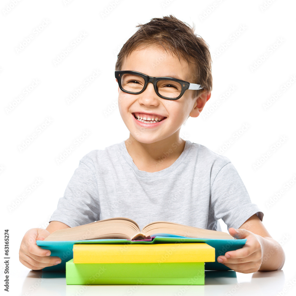 Little boy is reading a book Little boy is reading a book