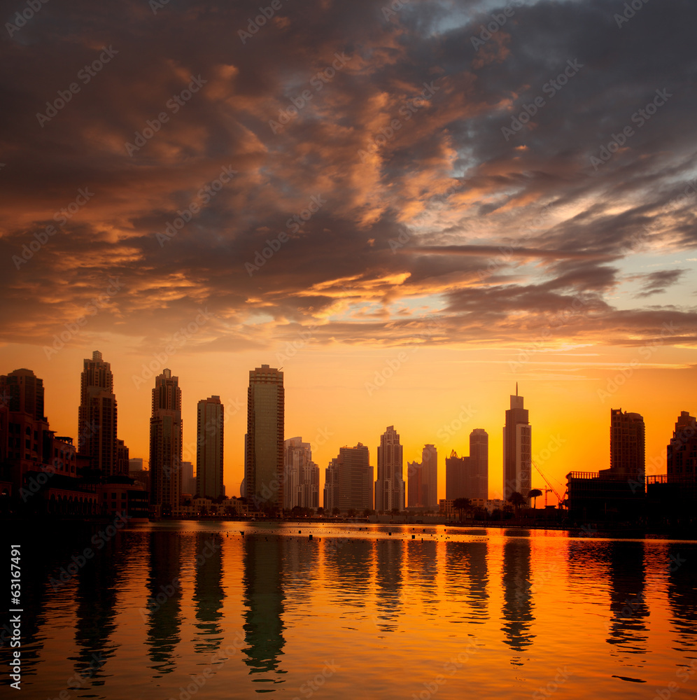 Fototapeta premium Dubai city with skyscrapers against sunset United Arab Emirates