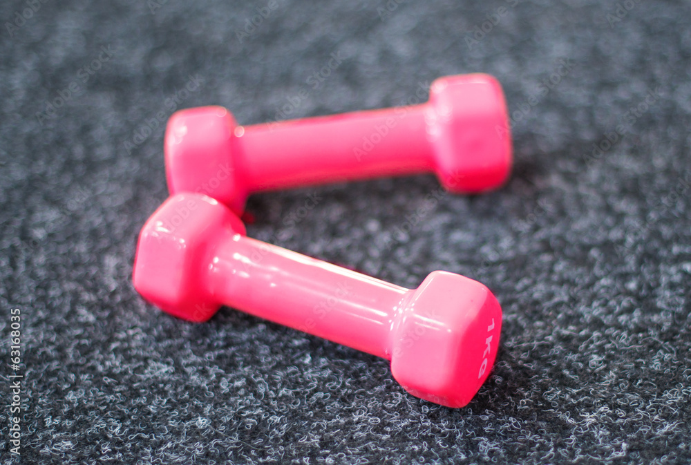 Dumbbells on the carpet in the gym Dumbbells on the carpet in the gym