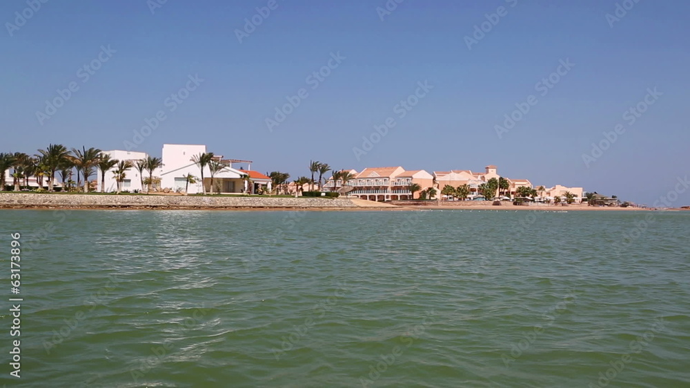 View of houses and hotels from boat floating on channels of El G View of houses and hotels from boat floating on channels of El G