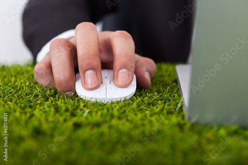 Businessman Using Laptop With Computer Mouse