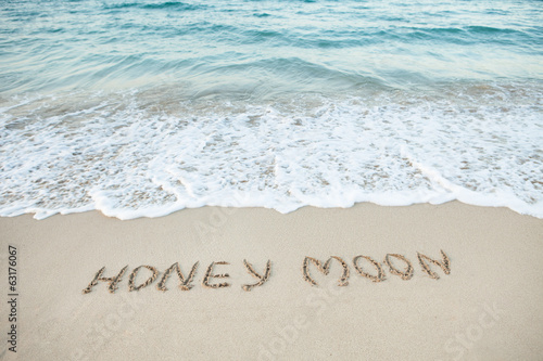 Word Honeymoon Written On Beach