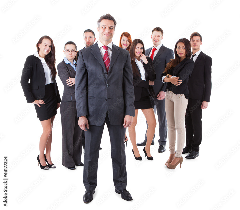 Senior business manager standing on front of his team