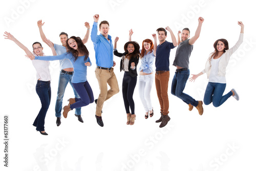 Group of diverse people raising arms and jumping