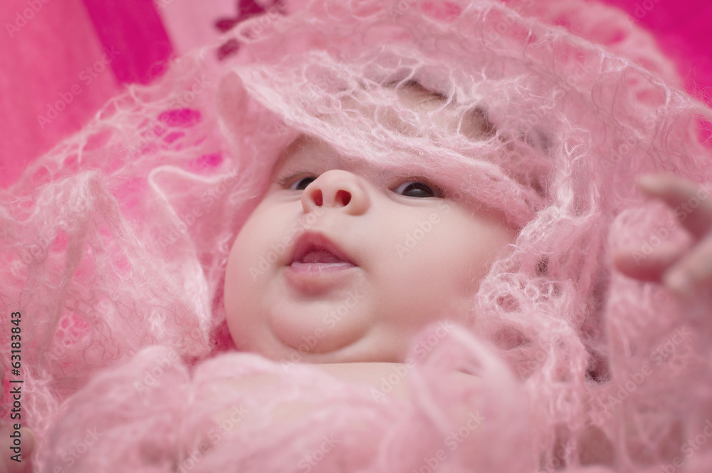 Beautiful baby girl on pink background