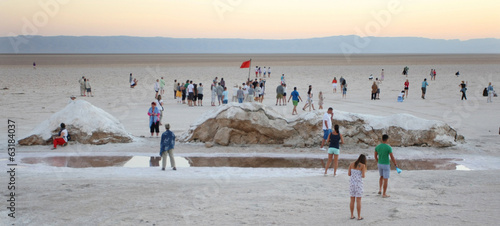 Tourists at salt lake Chott El Jerid photo