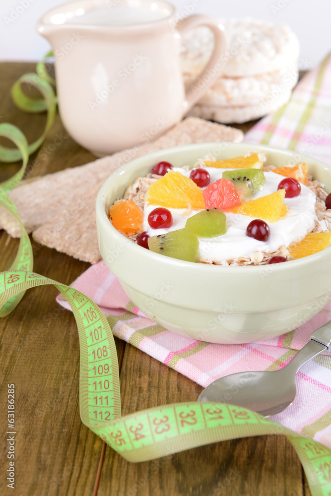 Delicious oatmeal with fruit in bowl on table close-up Delicious oatmeal with fruit in bowl on table close-up
